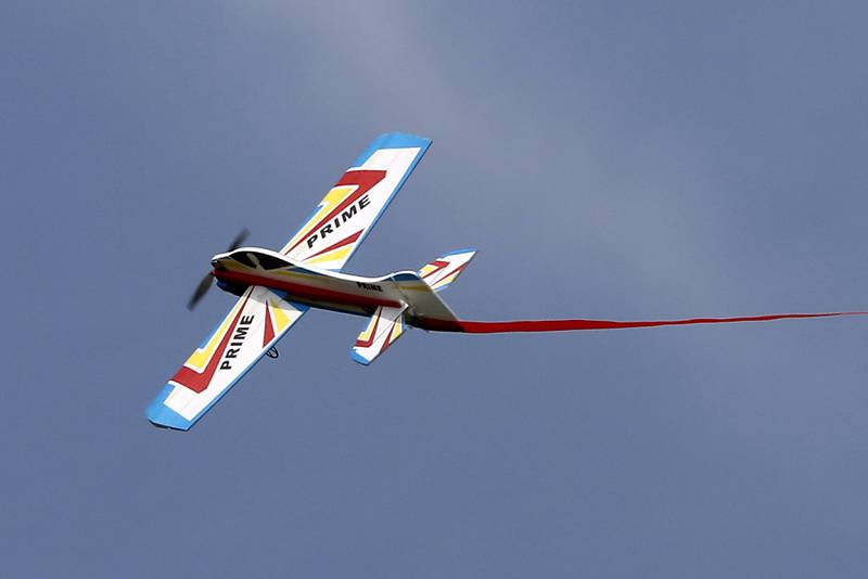 A radio-controlled plane flies through the air on Thursday, Aug. 8, 2024, near Hebron.