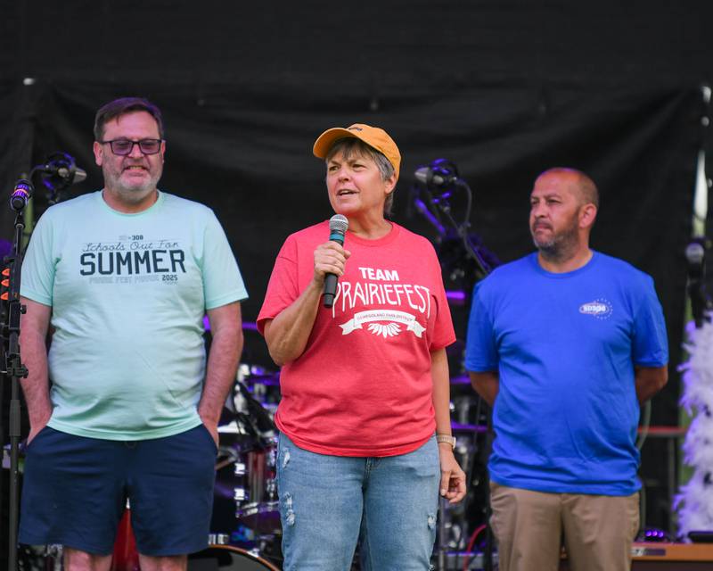 Oswego School Board member Mary Jo Wenmouth welcomes everyone on opening night of PrairieFest on Thursday June 12, 2025, held at PrairieFest Park in Oswego.