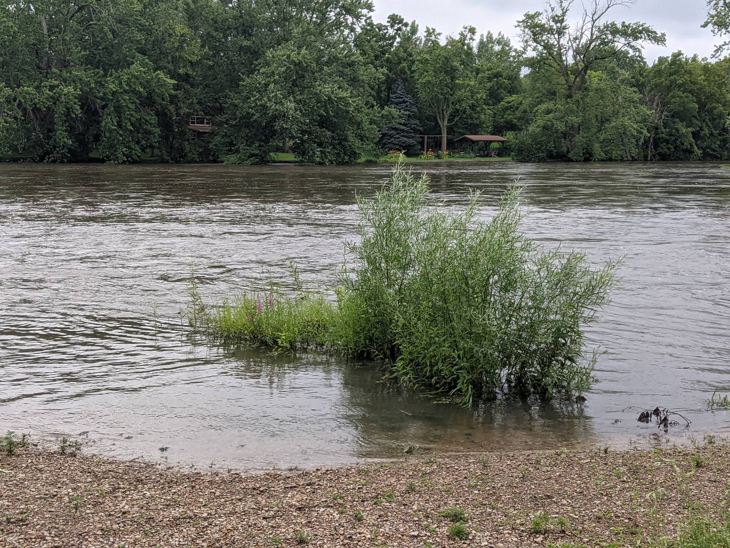 The Fox River was lapping the banks of Hudson Crossing Park in downtown Oswego Tuesday morning following Monday night's storms.