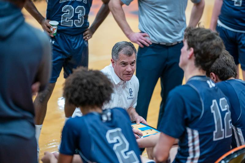 Oswego East's head coach Ryan Velasquez talks to his players during the hoops for healing basketball tournament at Naperville North High School on Monday, Nov 21, 2022.