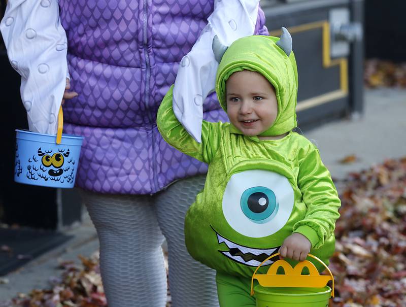 Fletcher Sorenson, 2, trick or treats during Halloween on the Square on Thursday, Oct. 31, 2024, in Woodstock. The event featured trick and treating and a costume contest.