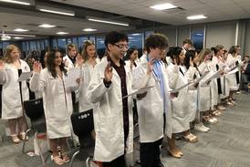 At McHenry High, students earn nursing assistant certifications, white coats