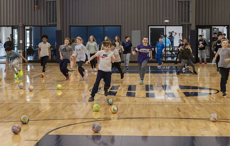 A game of Mushroom Ball kicks off at The Facility Wednesday, March 8, 2023 right after a quick lunch. Dixon schools had a half day of learning.
