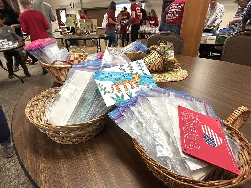 Cards and photos created by adults and children were part of care packages for sailors on the USS Fitzgerald at the Evangelical Free Church of Mt. Morris  on Thursday, Oct. 16, 2025.