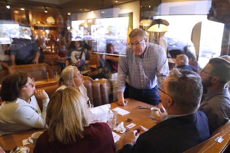 Republican candidate for governor Darren Bailey visits with people as he campaigns Wednesday, Sept. 21, 2022, at Around the Clock Restaurant, 5011 Northwest Highway, in Crystal Lake, during a nine-city bus tour, with his Lt. Governor candidate Stephanie Trussell.