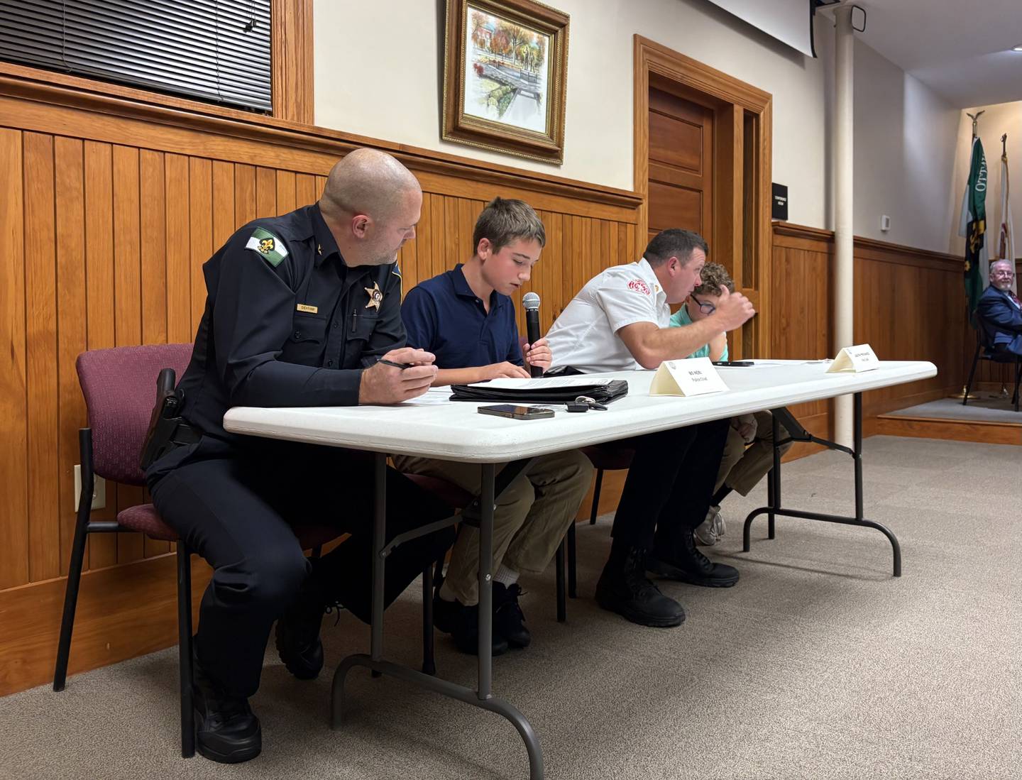 Bo Neri reads the police report while serving as Police Chief for Mike Cheatham during the Kiwanis Kids Club’s mock Ottawa City Council meeting Tuesday night at City Hall.