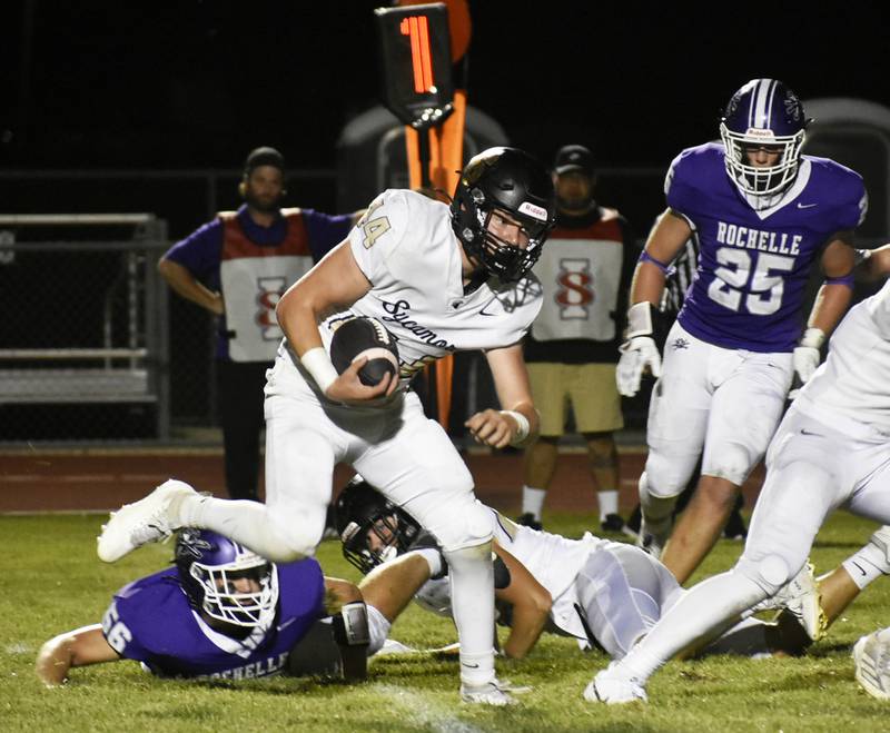 Sycamore’s Josiah Mitchell takes a carry during the Interstate 8 opener against Rochelle on Friday, Sept. 20, 2024