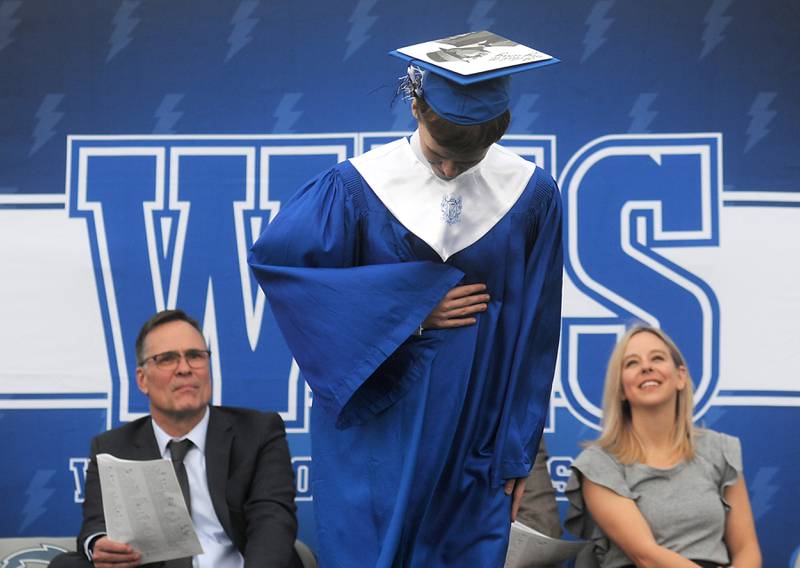 Michael Scott Draper takes a bow Sunday, May 15, 2022, during the Woodstock High School graduation ceremony in Woodstock.