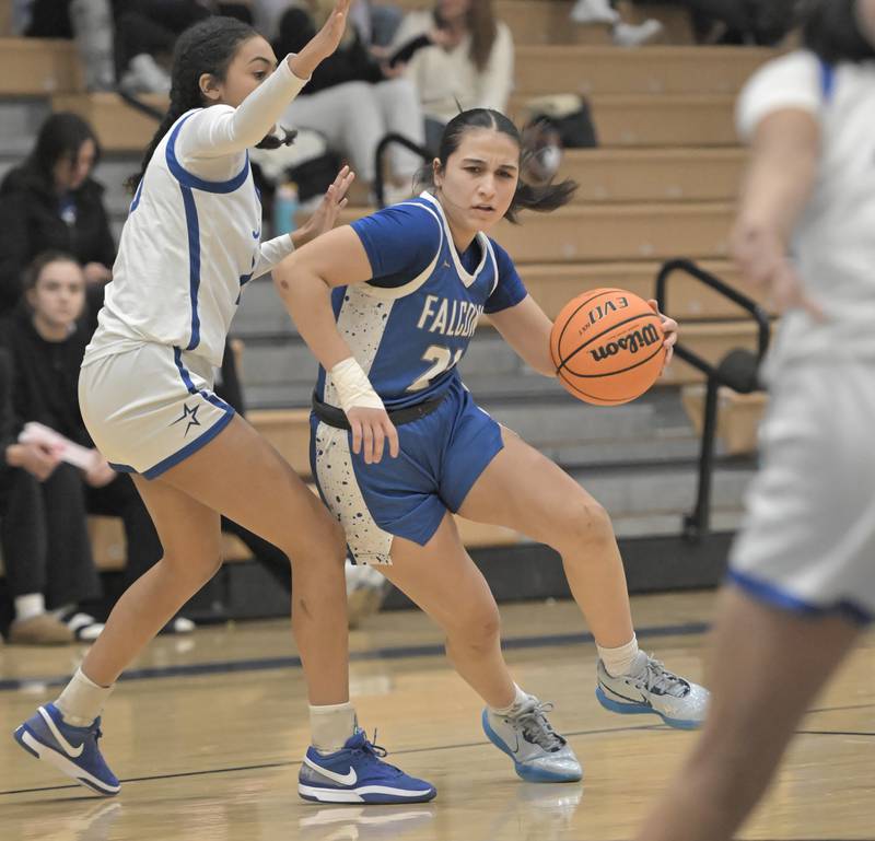 Wheaton North’s Sara Abdul loooks for room to drive against St. Charles North in a girls basketball game in St. Charles on Thursday, Jan. 23, 2025.
