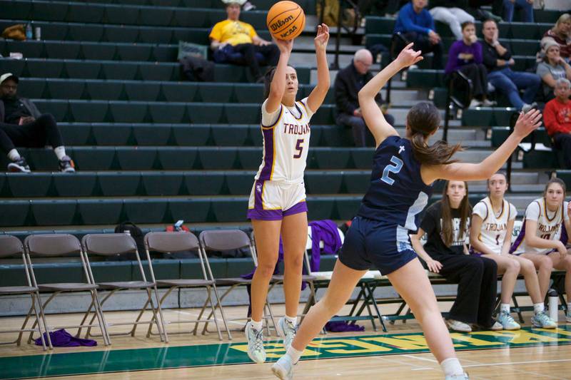 Downers Grove North's Campbell Thulin shoots a three pointer over Nazareth's Samantha Austin during the Dave Yates Chicagoland Showcase on Saturday, Dec7,2024 at Fremd in Palatine.