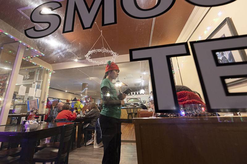 A server at Fresco on First dresses the part for the Dixon Christmas Walk Friday, Dec. 5, 2025.