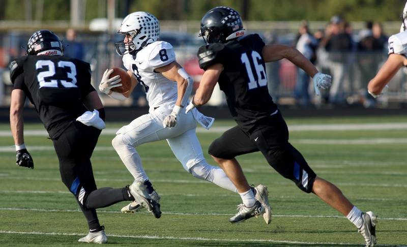 Cary-Grove’s Andrew Prio breaks for the end zone on a touchdown against Highland Park in second-round IHSA Class 6A playoff action at Wolters Field in Highland Park Saturday.
