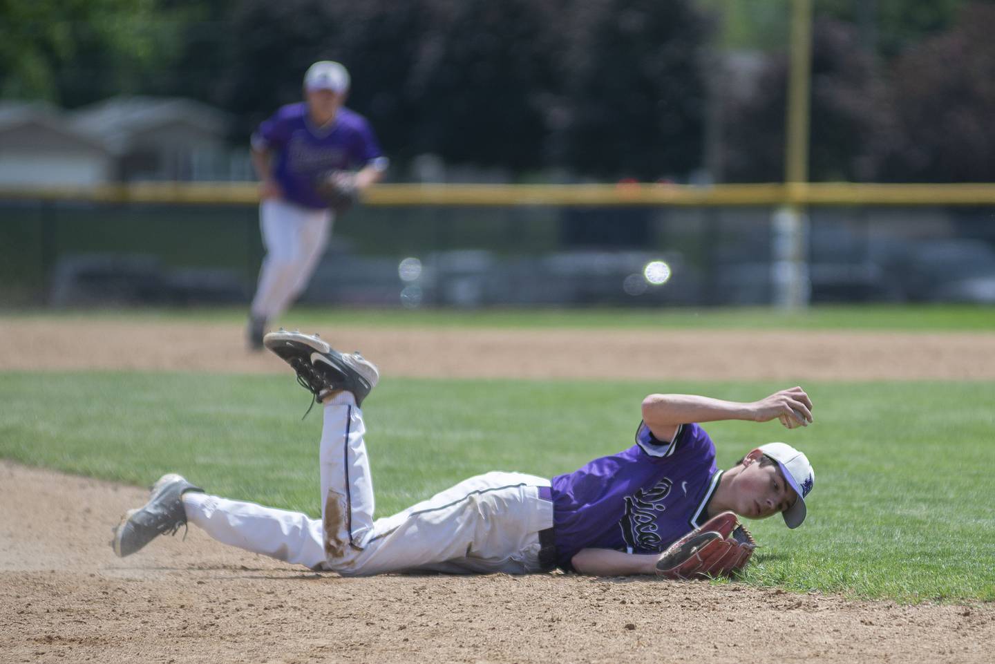 Dixon’s Alex Harrison makes a diving catch at third base against Sterling Saturday, May 28, 2022.