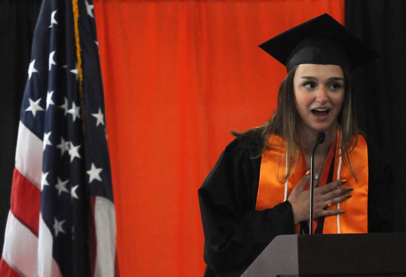Amelia Klebba leads the Pledge of Allegiance Saturday, May 14, 2022, during the graduation ceremony at Crystal Lake Central High School.