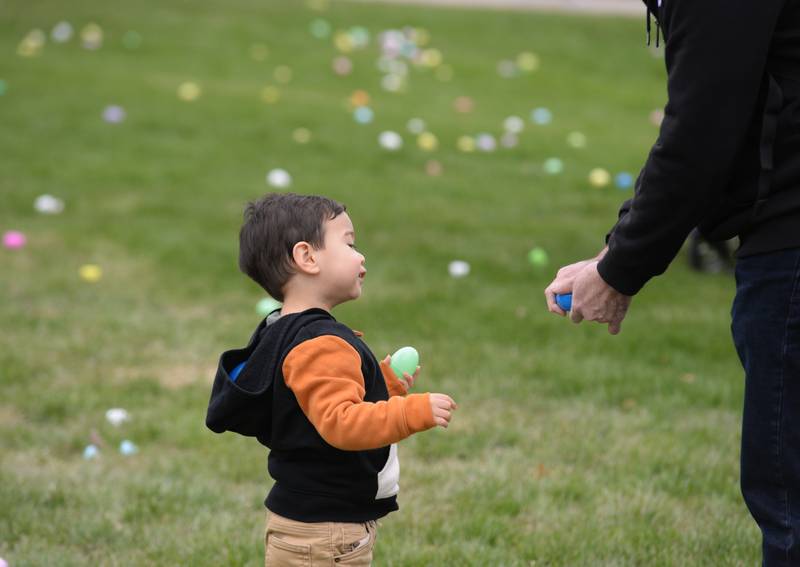 Ethan Servovio of Carol Stream waits to see what's inside his Easter Egg during the Easter Egg Hunt held at Cantigny  Sunday April 13, 2025.
