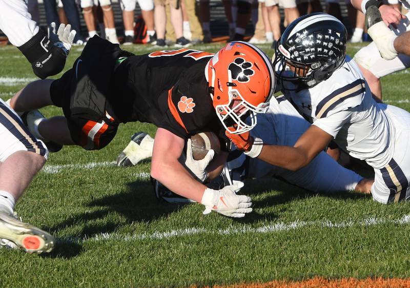 Byron's Kole Aken (5) dives for the end zone to score a touchdown against Elmhurst IC Catholic during 3A quarterfinals at Byron High School on Saturday, Nov. 15, 2025.