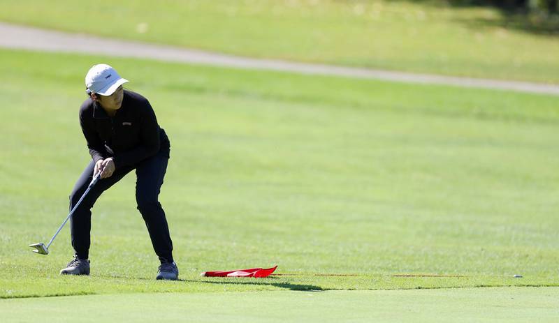 Amanda Nguyen of Glenbard North, reacts to her putt during the IHSA Class 2A West Chicago girls golf regional at St. Andrews Tuesday, Oct. 1, 2024 in West Chicago.