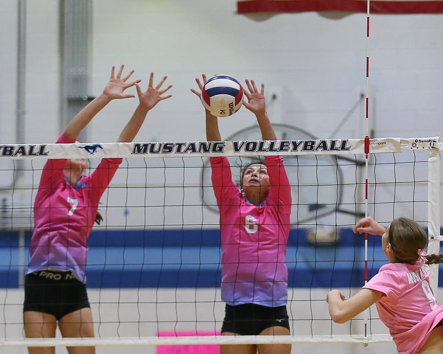 Willowbrook's Hannah Kenny (6) and Julia Amin (7) go for the block attempts during volleyball match between Willowbrook at Downers Grove South.  Oct 1, 2024. in Downers Grove.