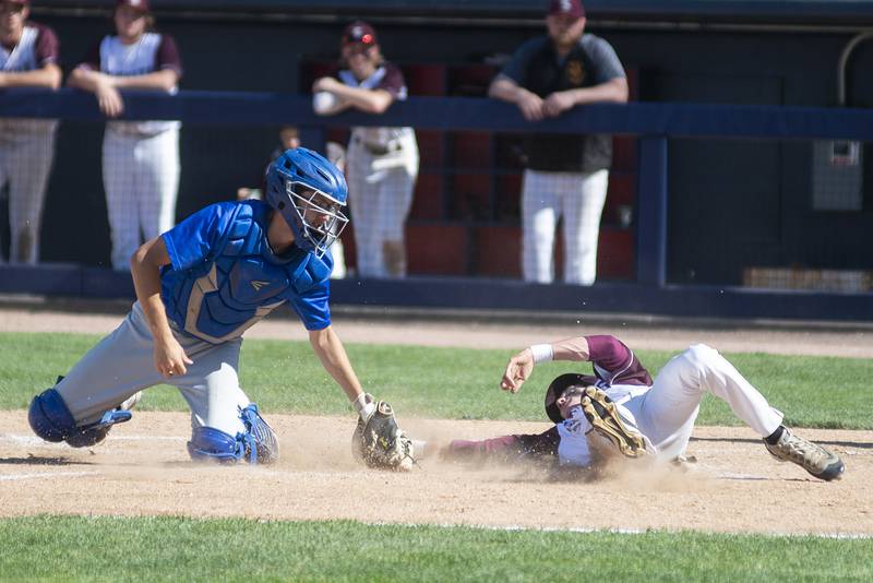 Richmond-Burton’s Jason Miller is tagged out at home by Maroa-Forsyth’s Rhyes Sams-Moore Friday, June 3, 2022 during the IHSA Class 2A baseball state semifinal.