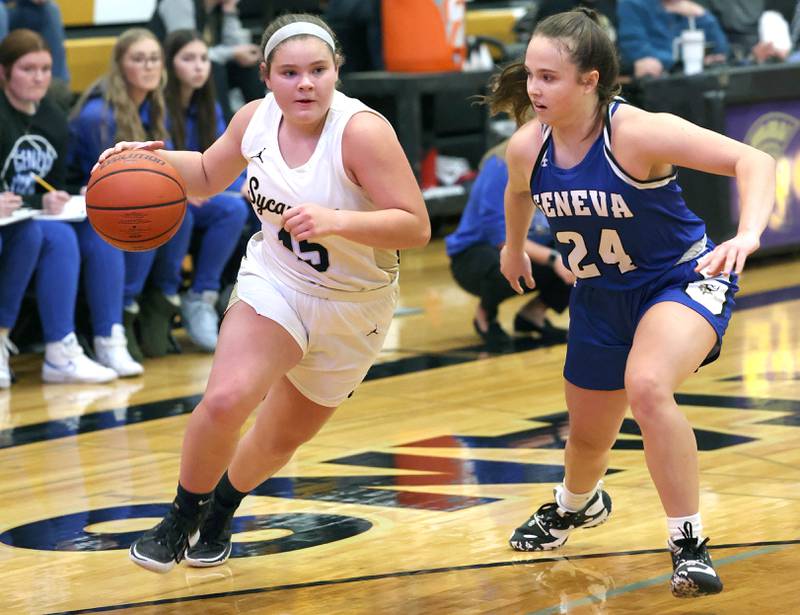 Sycamore's Sophia Klacik drives against Geneva's Kinsey Gracey during their game Monday, Nov. 14, 2022, at Sycamore High School.