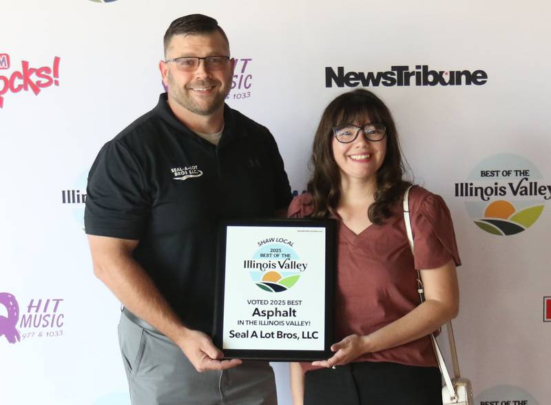 The staff of Seal A Lot Bros. LLC poses for a photo during the second annual Best of the Illinois Valley event on Thursday at the Auditorium Ballroom in La Salle.
