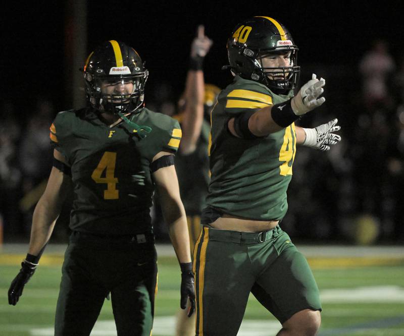 Fremd’s John Stevens celebrates his interception in the first half against Hoffman Estates in a football game in Palatine on Friday, Sept. 27, 2024.