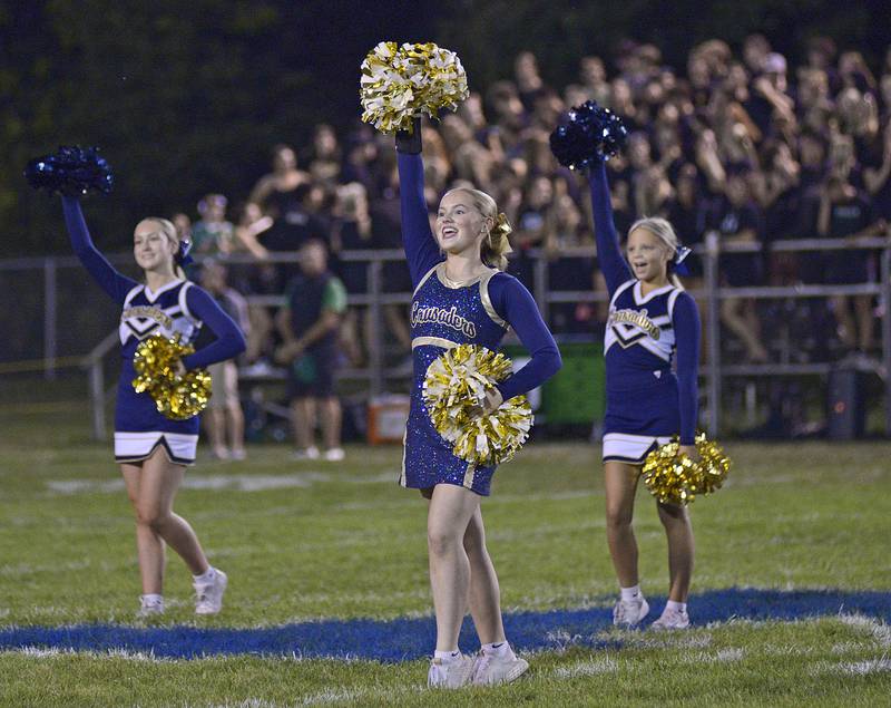 Marquette Crusader cheerleaders rev the crowd up prior to the start of Friday nights game against Seneca.