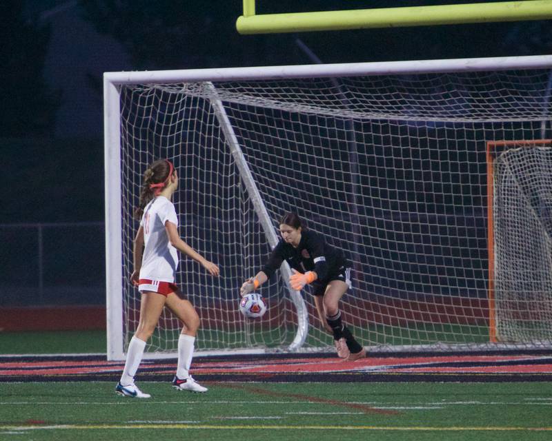 Marian Central's Anna Lingle blocks a shot by Huntley on Wednesday March 22, 2023 in Huntley.