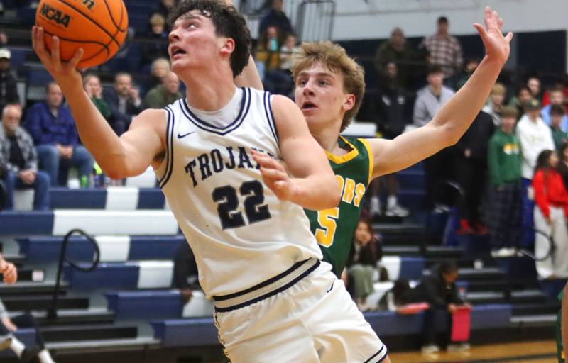 Cary-Grove’s Adam Bauer gets past Crystal Lake South’s Carson Trivellini in varsity boys basketball on Wednesday, Dec. 3, 2025, at Cary-Grove High School in Cary.