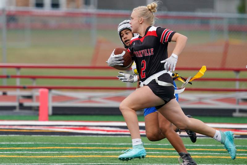 Yorkville's Brooke Ekwinski (2) carries the ball for a touchdown against Joliet Central during a flag football game at Yorkville High School on Monday, Sep 23, 2024.