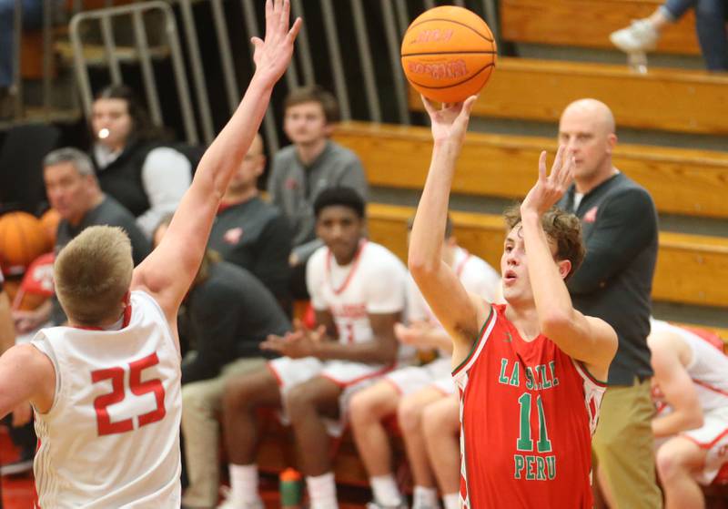 L-P's Jameson Hill shoots a jump shot over Streator's Joseph Hoekstra on Tuesday, Jan. 13, 2026 in Pops Dale Gymnasium at Streator High School.