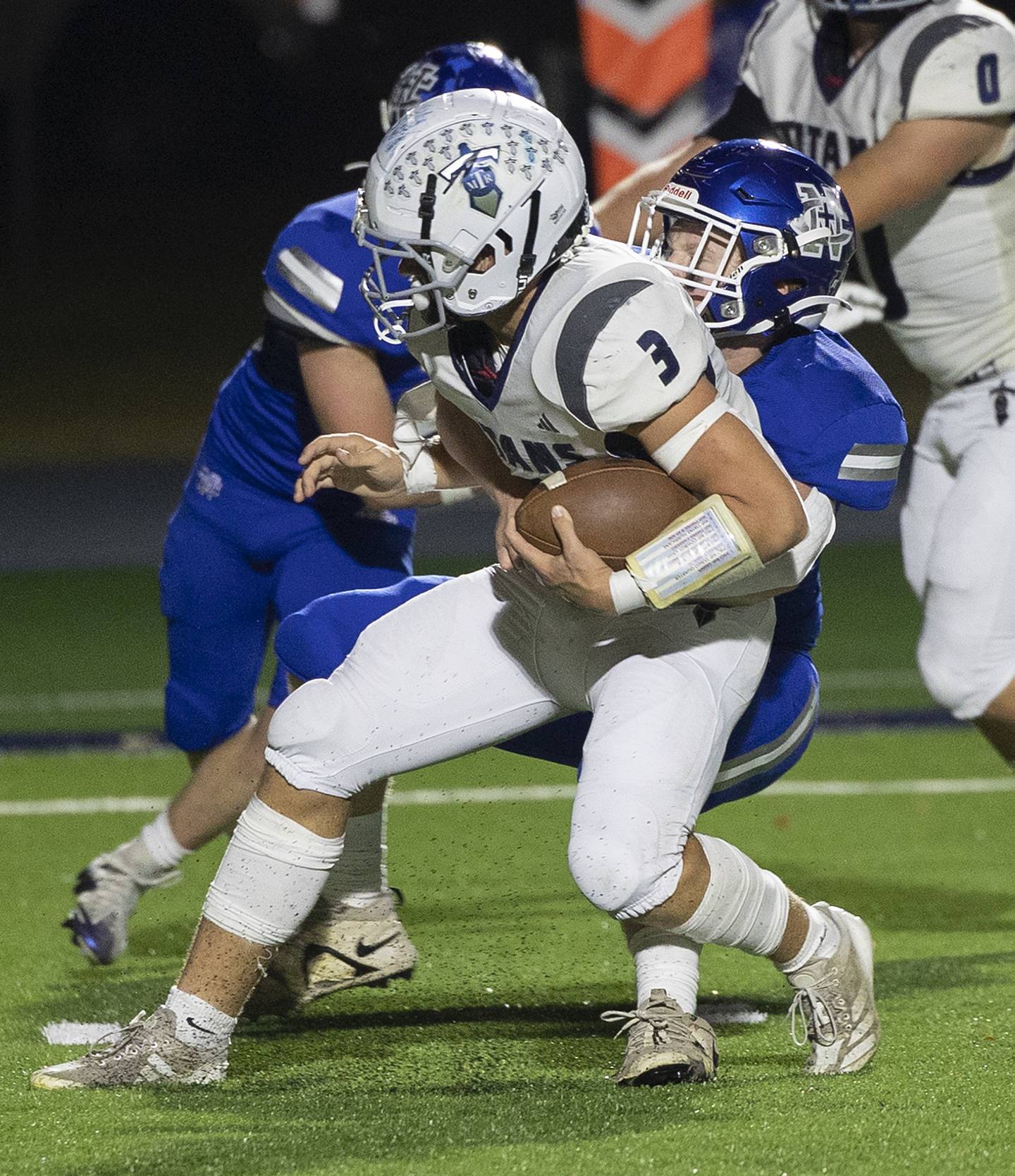 Newman’s Benjamin Geske sacks Monmouth-Roseville’s Andy Myers Friday, Oct. 25, 2024, at Roscoe Eades Stadium in Sterling.