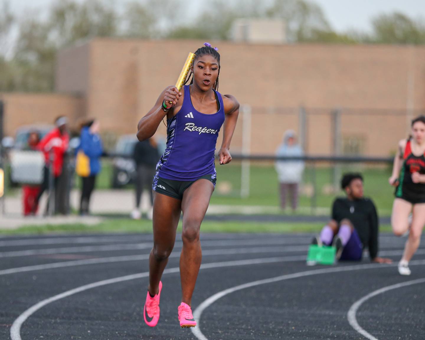 Plano's Favour Amakari runs in the 4x100 meters at the Field of Dreams Plano Invitational.  April 21, 2023.