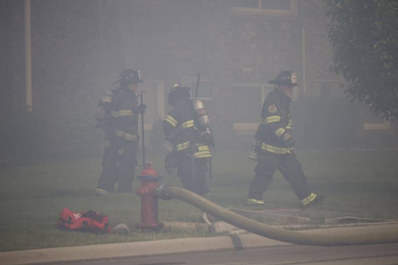 Joliet firefighters at the scene of a fire at an apartment building on Tuesday, June 10, 2025, near Essington Road in Joliet.