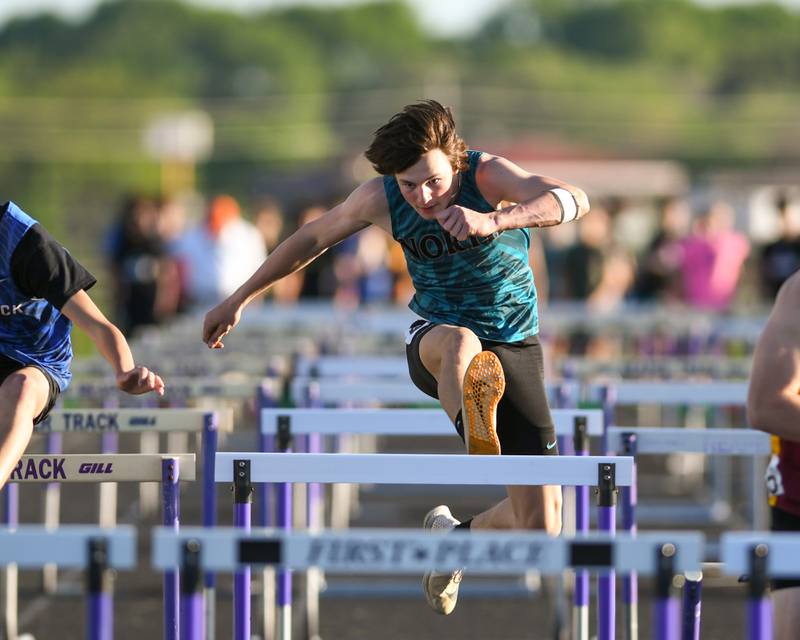 Landon Creighton of Woodstock North competes in the 110 meter hurdles during the Kishwaukee River Conference track meet on Tuesday May 7, 2024, held at Plano High School.