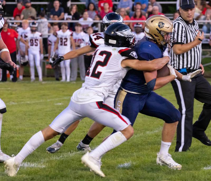 Marquette's Jurnee Reed tries to shed Aurora Christian's Sal Delgado on a carry in the second quarter on Friday, Aug. 26, 2022, at Gould Stadium in Ottawa.