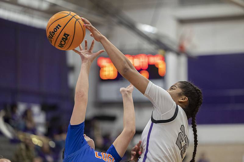 Dixon’s Ahmyrie McGowan blocks a shot by G-K’s Zoe Boylen Tuesday, Jan. 27, 2026.