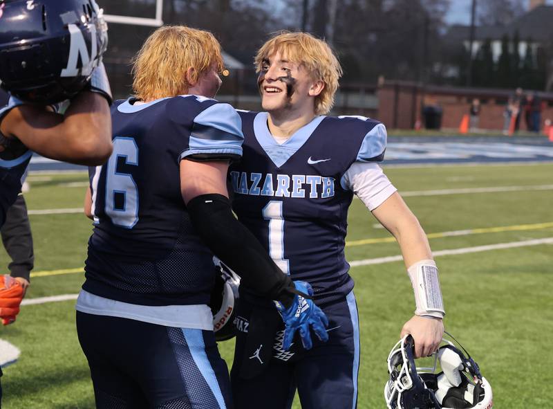 Nazareth's Logan Malchuk (1) is all smiles after winning against St. Francis at the boys varsity IHSA 5A semifinal between Nazareth Academy and St. Francis high school in La Grange Park, IL on Saturday, Nov. 18, 2023.