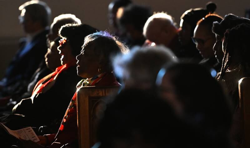 Parishioners listen during a Martin Luther King Jr. celebration at First United Methodist Church in Downers Grove Sunday.