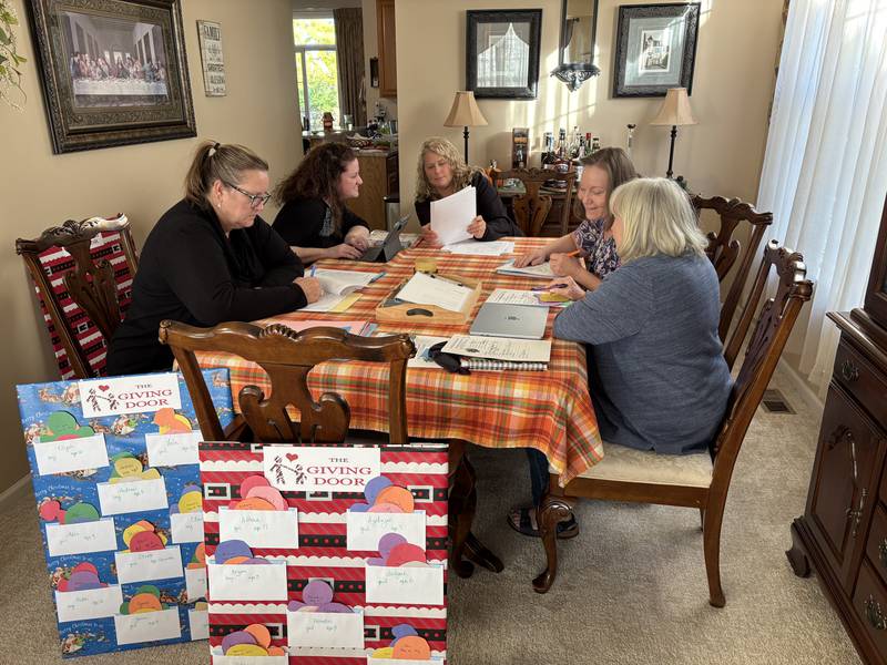 The Giving Door volunteers organize adoptive family wish lists for people to anonymously purchase gifts for.