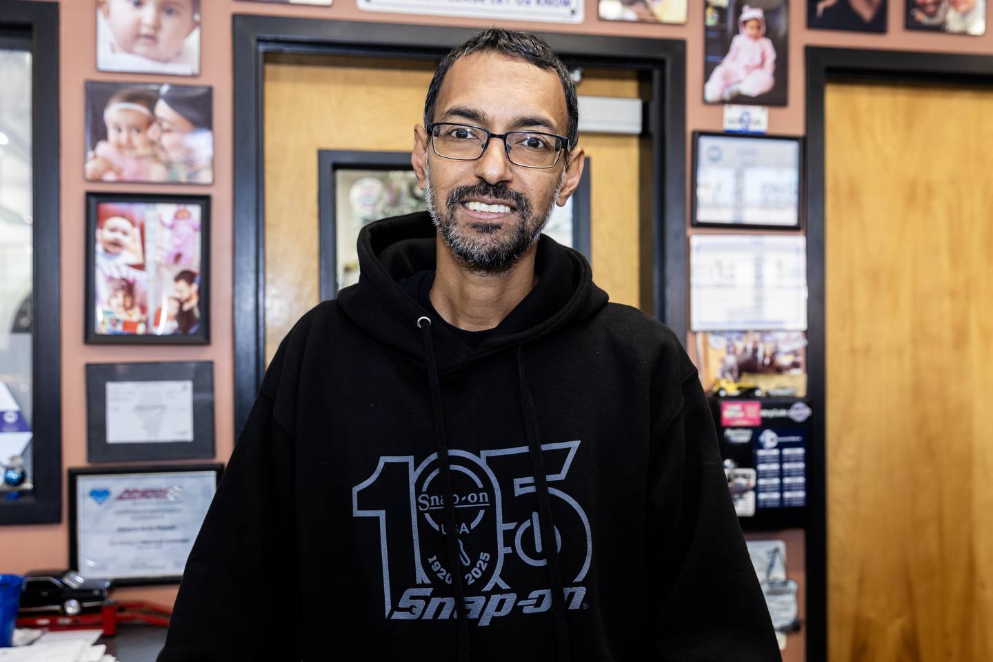 Crest Hill business owner Reza Jaddi, who supports veterans anyway he can, poses for a photo in Reza’s Auto Repair in Crest Hill on Oct. 9, 2025.