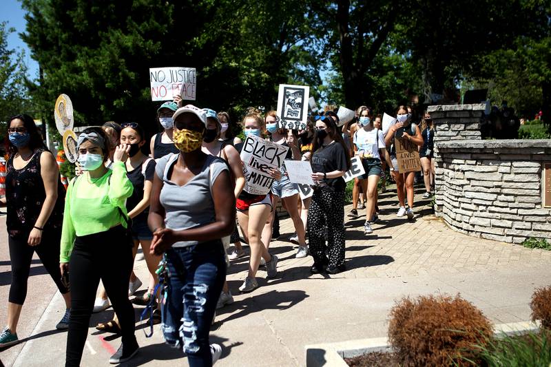Young protesters march from Adams Park through downtown Wheaton for Black Lives Matter on June 12.
