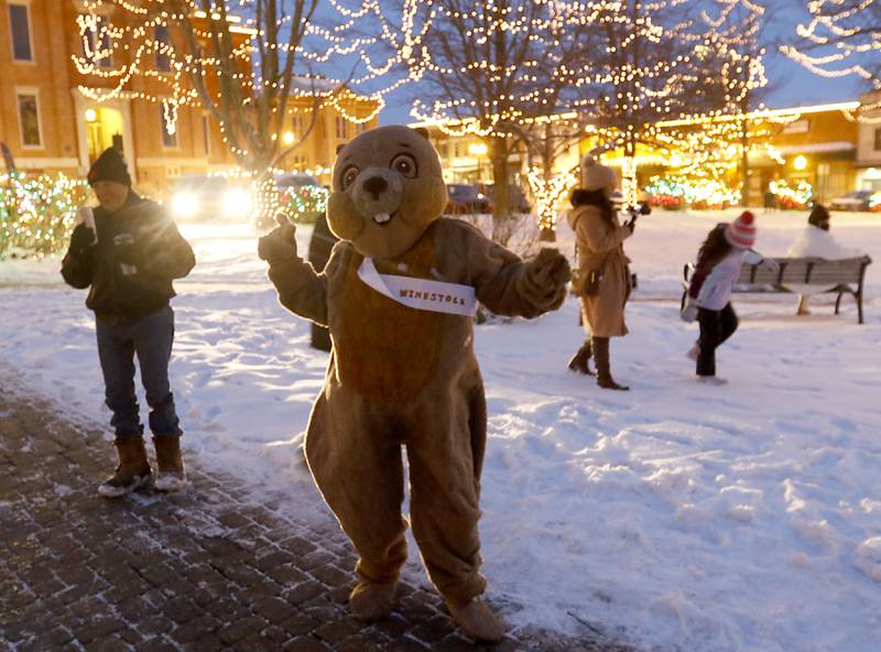 The Woodstock Willie mascot dances Wednesday, Feb, 2, 2022, during the annual Groundhog Day Prognostication on the Woodstock Square. This is the 30th anniversary of when the movie “Groundhog Day” was filmed in Woodstock.
