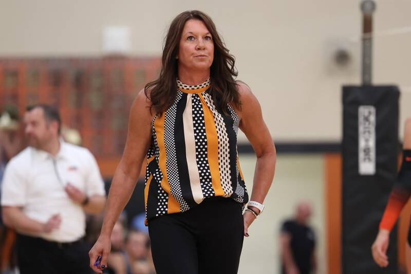 Minooka head coach Carrie Prosek checks the scoreboard against Joliet Catholic on Wednesday, Sept. 4, 2024 in Minooka.