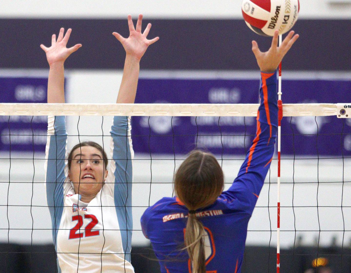 Marian Central’s Hadley Rogge blocks against Genoa-Kingston in varsity volleyball tournament action on Saturday, Sept. 21, 2024, at Hampshire High School in Hampshire.