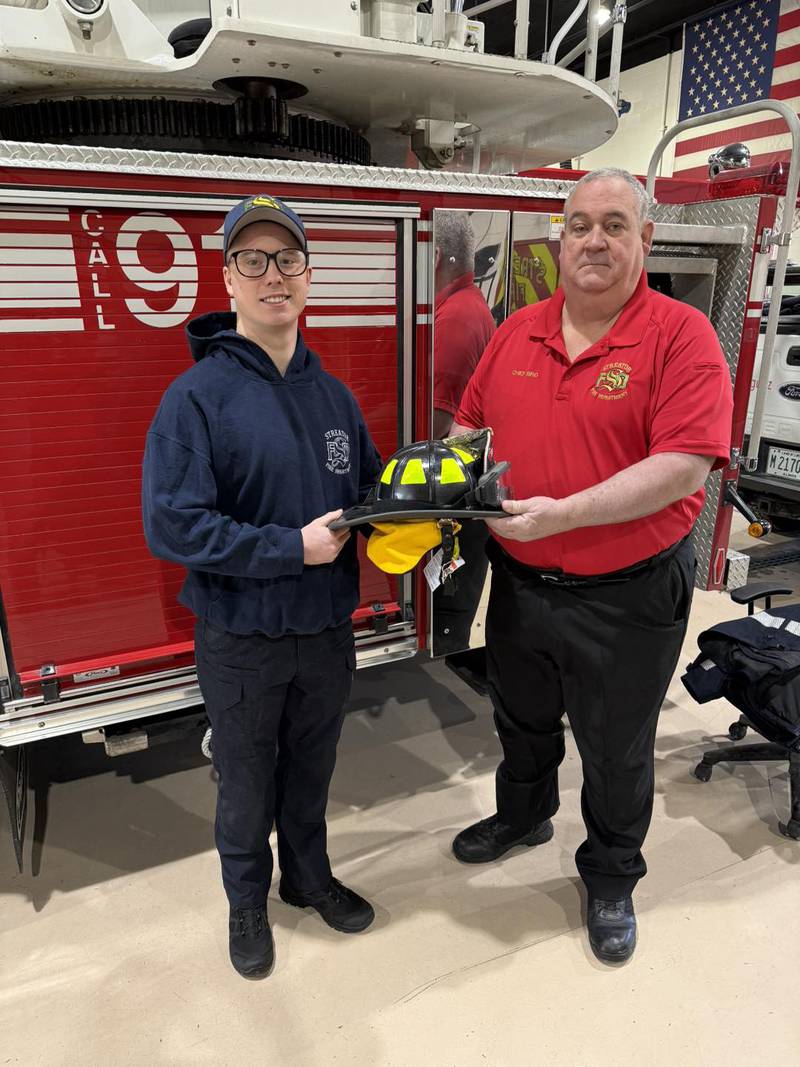 Firefighter Dustin Holland (left) joined the Streator Fire Department on Monday, Feb. 17, 2025. He is pictured with Fire Chief Gary Bird.