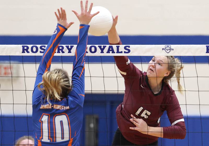 Marengo's Mia Lulinski tries to spike the ball past Genoa-Kingston's Rylie Stoffregen Thursday, Oct. 27, 2022, during their Class 2A Regional final match at Rosary High School in Aurora.