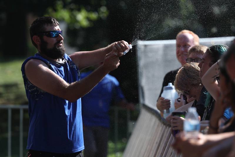 Security spays water on the crowd before a performance on the Rebel stage on day three of Riot Fest. Saturday, Sept. 18, 2022, in Chicago.
