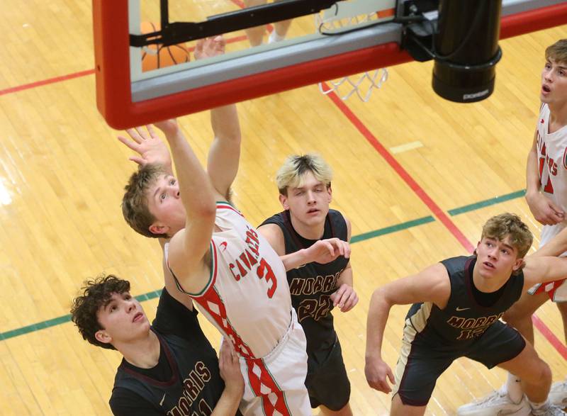 L-P's Braylin Bond lets go of a shot under the hoop over Morris's Brycen Johnson on Monday, Feb. 9, 2026 in Sellett Gymnasium at L-P High School.