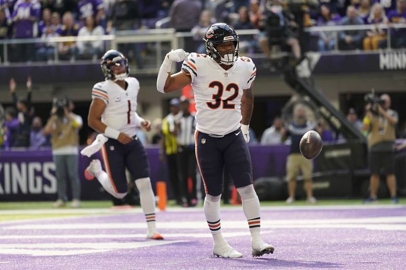 Chicago Bears running back David Montgomery celebrates after scoring on a 9-yard touchdown run during the first half against the Minnesota Vikings, Sunday, Oct. 9, 2022, in Minneapolis.